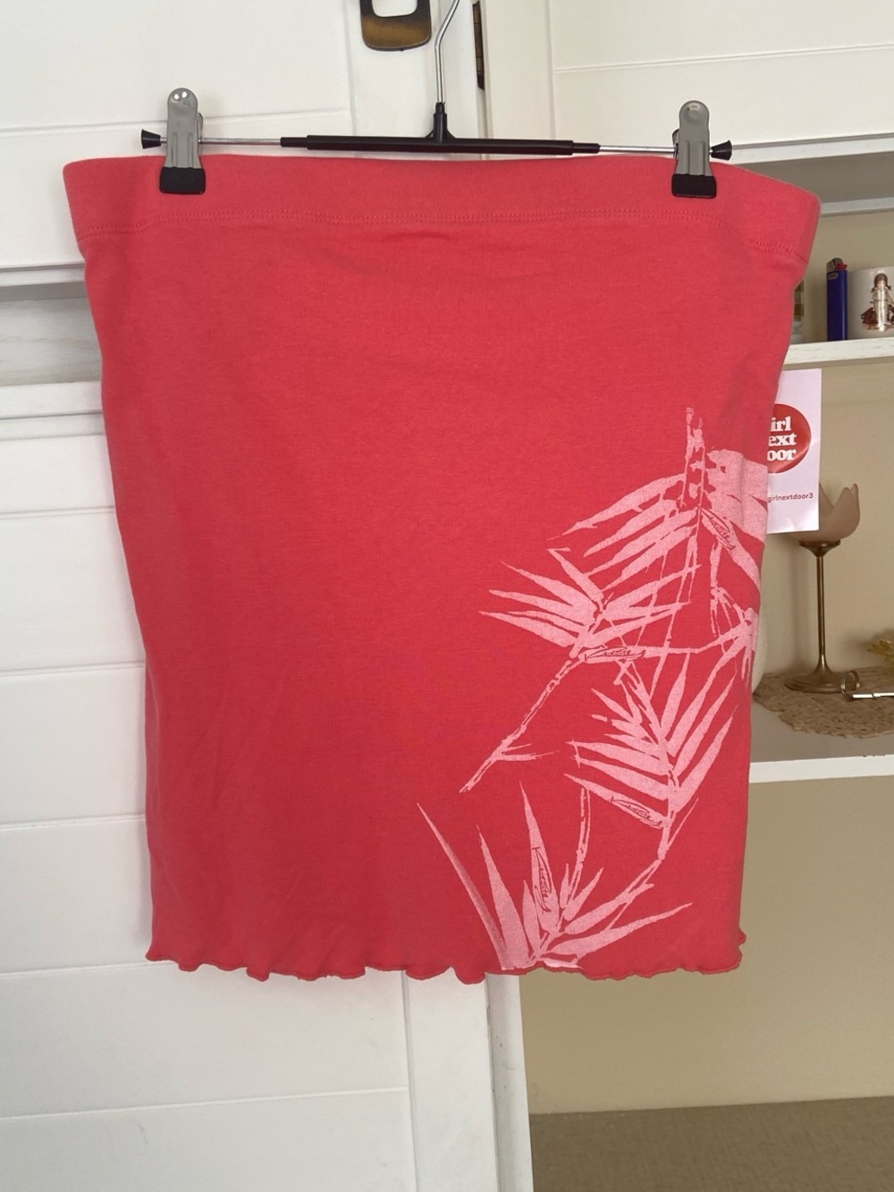 Pink tube top with white palm tree graphic